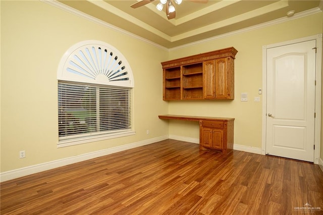 5501 N 8th St, Mcallen, TX 78504 - interior space featuring dark wood-style flooring, baseboards, built in desk, ceiling fan, and ornamental molding