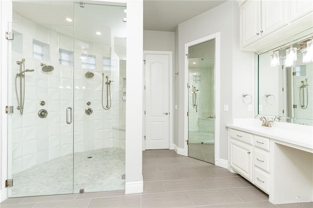 5501 N 8th St, Mcallen, TX 78504 - bathroom with baseboards, vanity, tile patterned floors, and a stall shower