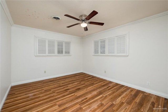 1500 N Bryan Rd, Mission, TX 78572 - empty room with ceiling fan, baseboards, wood finished floors, and crown molding