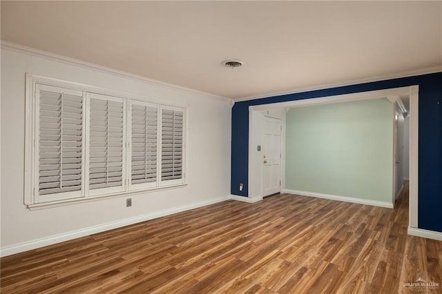 1500 N Bryan Rd, Mission, TX 78572 - empty room with wood finished floors, crown molding, and baseboards