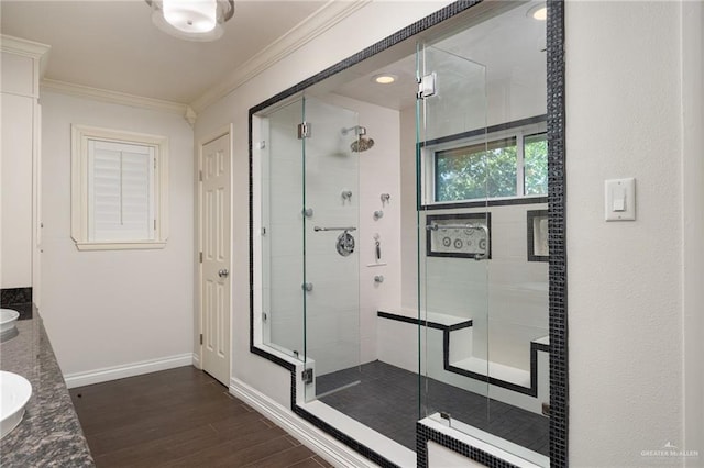 1500 N Bryan Rd, Mission, TX 78572 - bathroom with crown molding, a shower stall, wood finished floors, baseboards, and double vanity