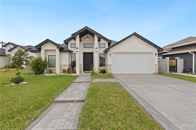 view of front of house featuring a garage and a front yard