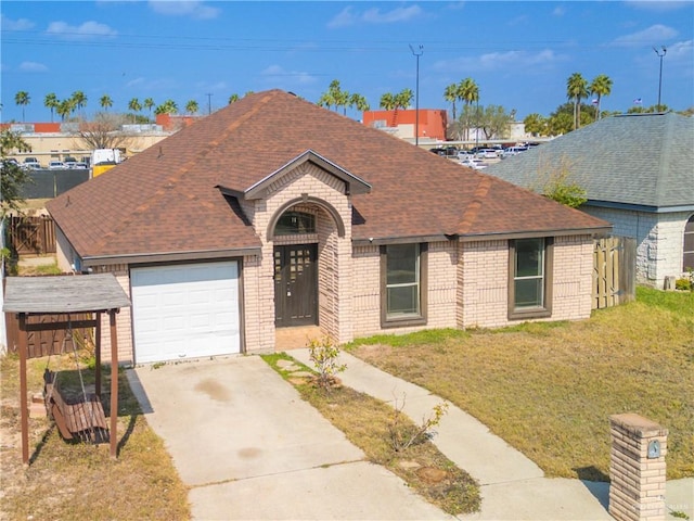 view of front of home with a garage and a front yard