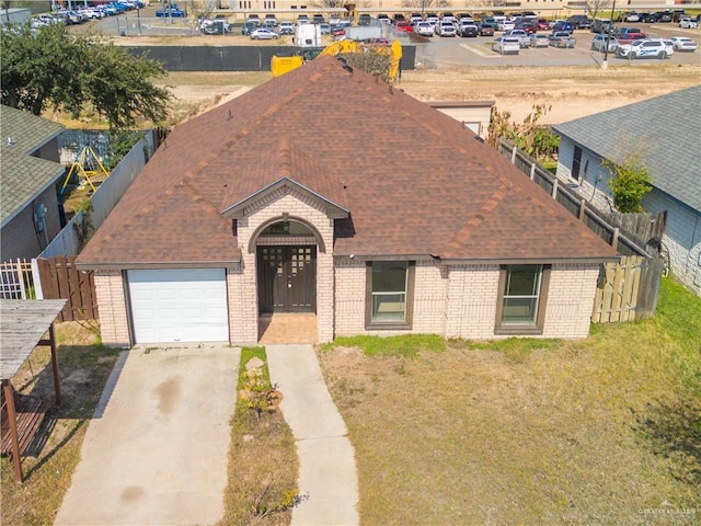 exterior space featuring a garage and a front yard