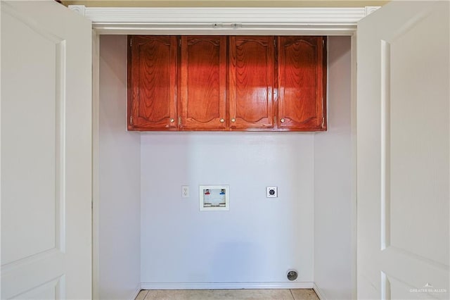 laundry area featuring cabinets, hookup for a washing machine, and hookup for an electric dryer