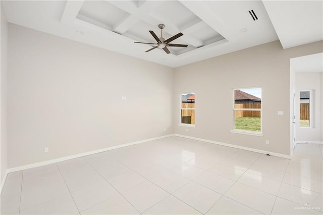 tiled spare room with ceiling fan and coffered ceiling