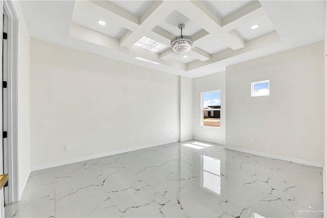 empty room featuring beamed ceiling and coffered ceiling