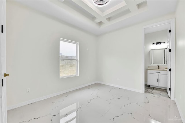 unfurnished bedroom featuring sink and connected bathroom