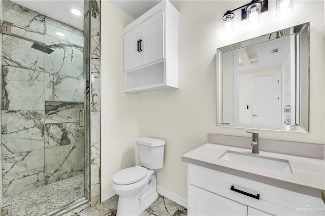 bathroom with vanity, toilet, and a shower with shower door