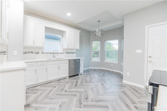 kitchen with white cabinetry, sink, stainless steel dishwasher, and a notable chandelier