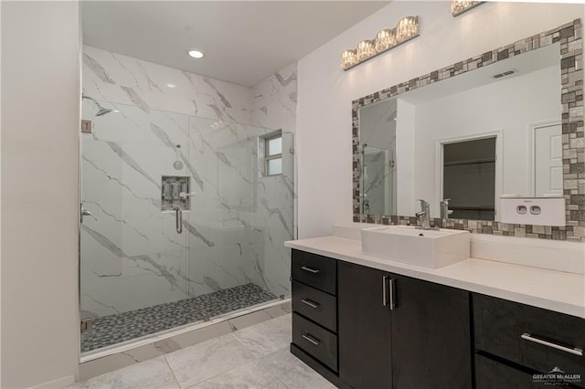 bathroom with vanity and an enclosed shower