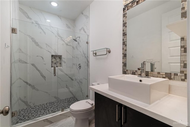 bathroom with vanity, backsplash, toilet, and walk in shower