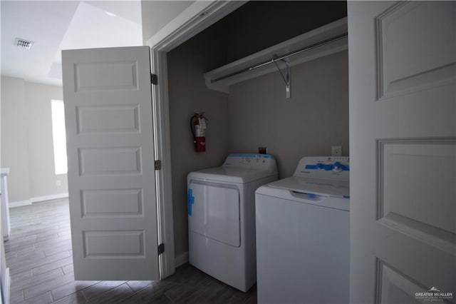 3131 Stark Rd, Weslaco, TX 78596 - washroom featuring washing machine and clothes dryer and dark wood finished floors