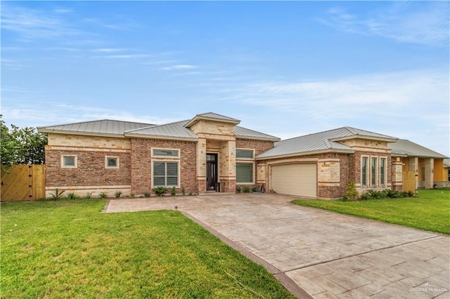 prairie-style home with a front yard and a garage