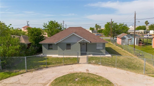201 E Durango Dr, Pharr, TX 78577 - bungalow-style home featuring stucco siding, a front yard, concrete driveway, and a fenced front yard