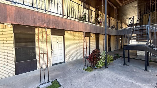 exterior space with a garage and stairway