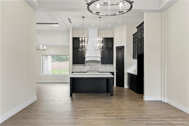 3317 Yellowhammer Ave, Mcallen, TX 78504 - kitchen featuring a chandelier, custom range hood, light wood-style floors, recessed lighting, and light countertops