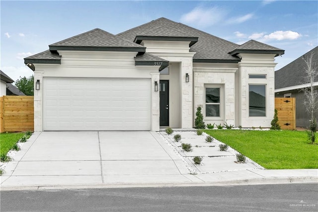 3317 Yellowhammer Ave, Mcallen, TX 78504 - view of front of home featuring a shingled roof, an attached garage, and driveway