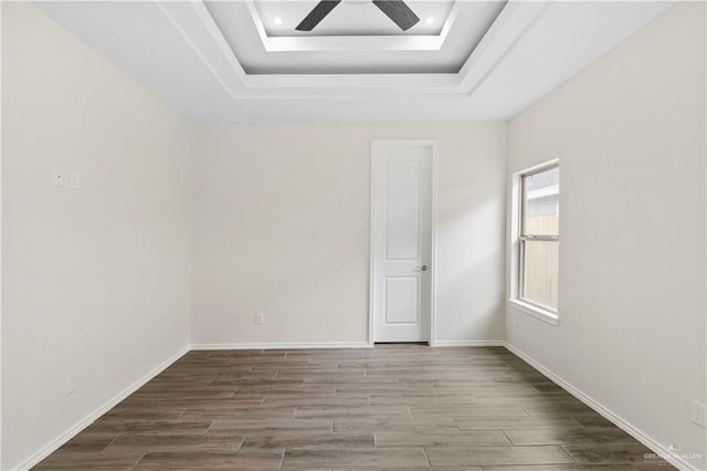 3317 Yellowhammer Ave, Mcallen, TX 78504 - spare room featuring a ceiling fan, wood finished floors, a tray ceiling, recessed lighting, and baseboards