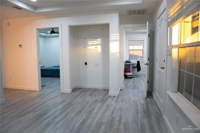 corridor with wood-type flooring