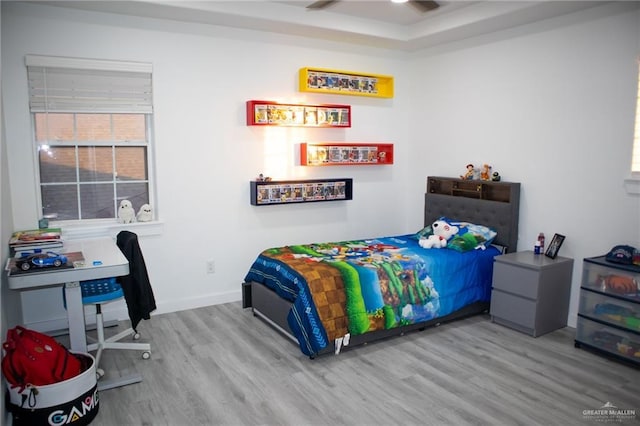 bedroom with hardwood / wood-style flooring