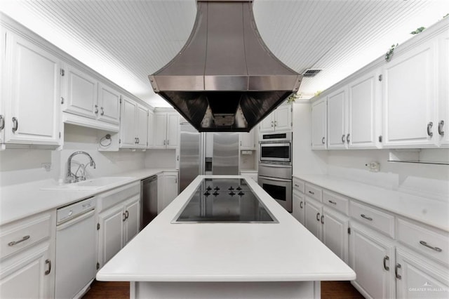 kitchen featuring a center island, sink, stainless steel appliances, island range hood, and white cabinets