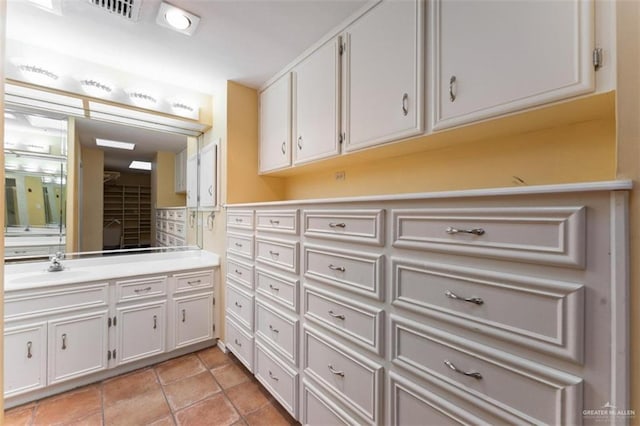 bathroom featuring tile patterned flooring and vanity