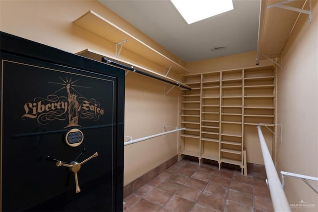 spacious closet featuring tile patterned flooring