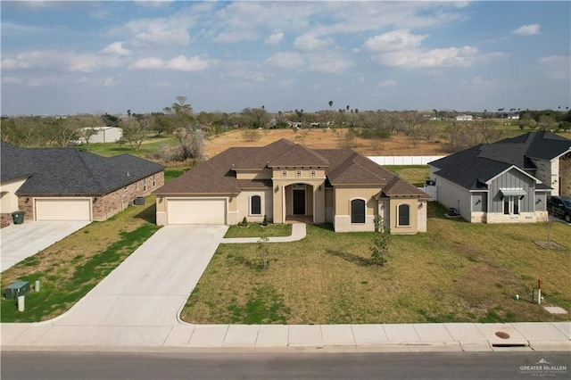 view of front facade with a garage and a front yard