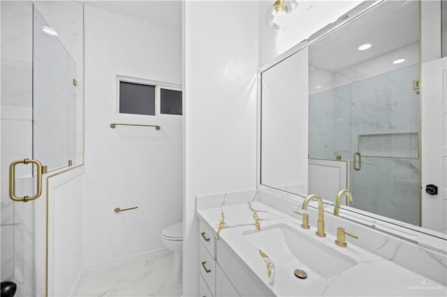 bathroom with a shower with door, vanity, and toilet