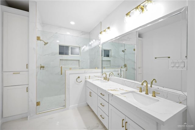 bathroom featuring vanity and an enclosed shower