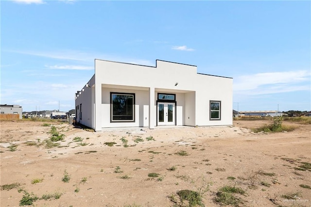 back of property featuring french doors