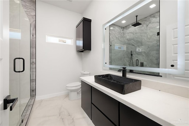 bathroom with vanity, an enclosed shower, and toilet