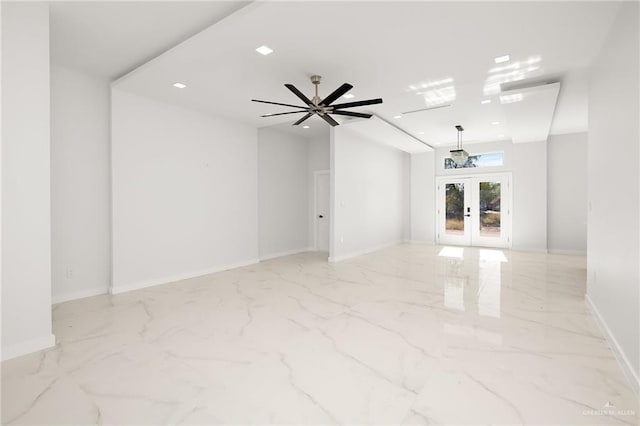 spare room featuring french doors and ceiling fan