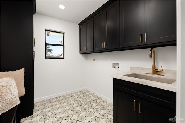 washroom featuring sink, cabinets, and hookup for a washing machine