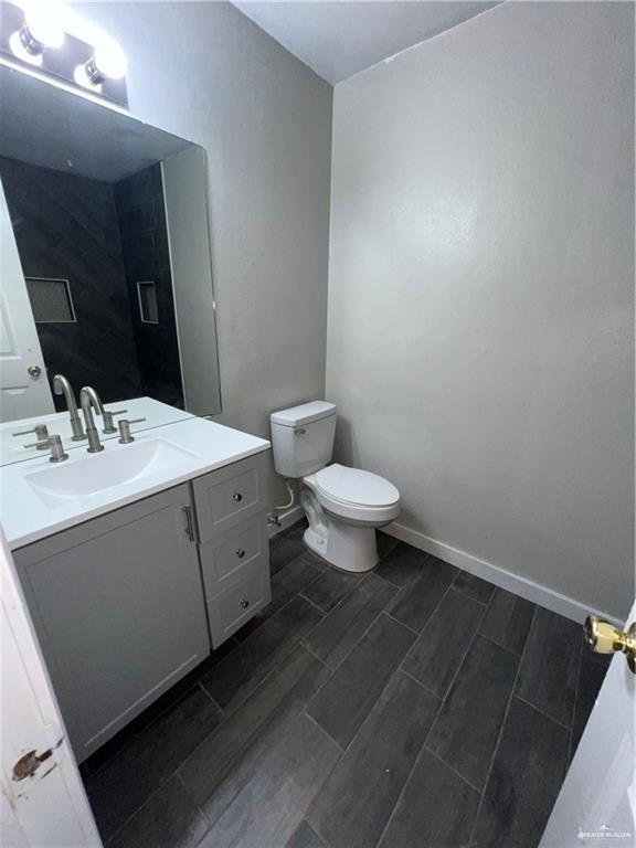 bathroom with vanity and toilet