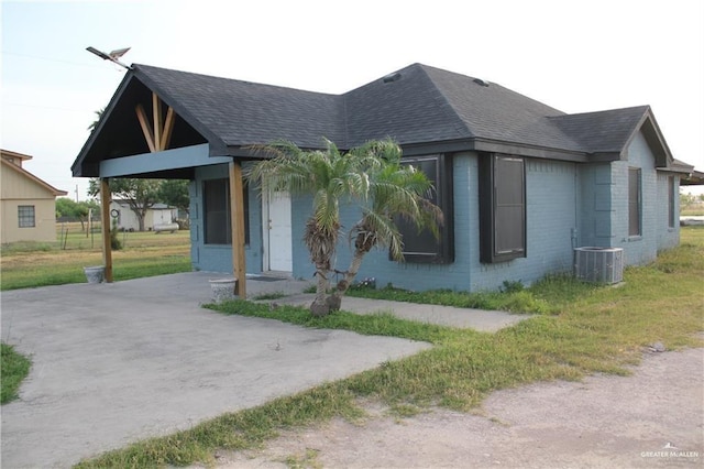 view of front of home featuring central air condition unit