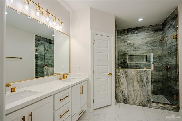 bathroom with vanity and a shower with door