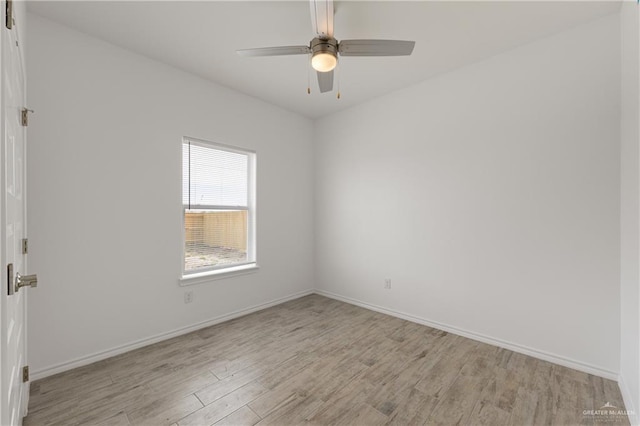 unfurnished room with ceiling fan and light wood-type flooring