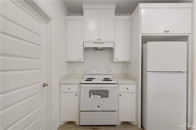 kitchen with white cabinetry, light wood-type flooring, and white appliances