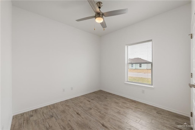 spare room featuring ceiling fan and light hardwood / wood-style floors