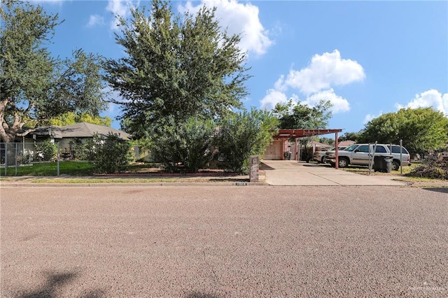 1604 E Kennedy Ave, Alton, TX 78573 - obstructed view of property with driveway and an attached carport