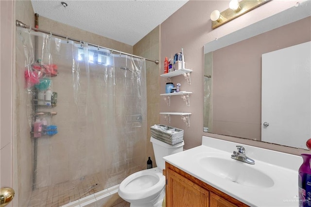1604 E Kennedy Ave, Alton, TX 78573 - bathroom with vanity, a textured ceiling, and tiled shower