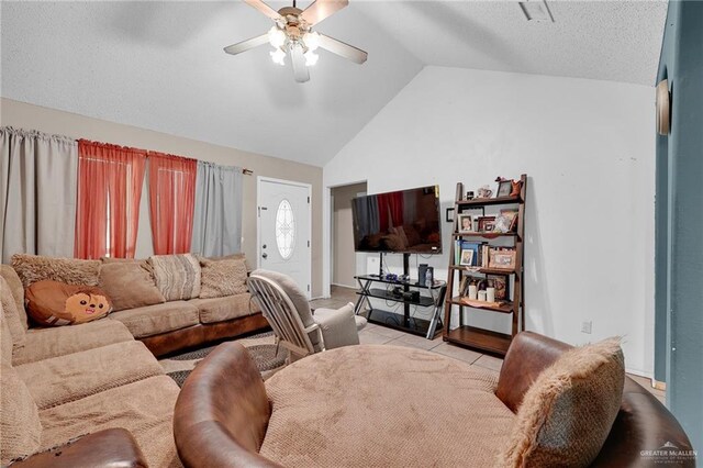 1604 E Kennedy Ave, Alton, TX 78573 - living room with lofted ceiling, a ceiling fan, and light tile patterned floors