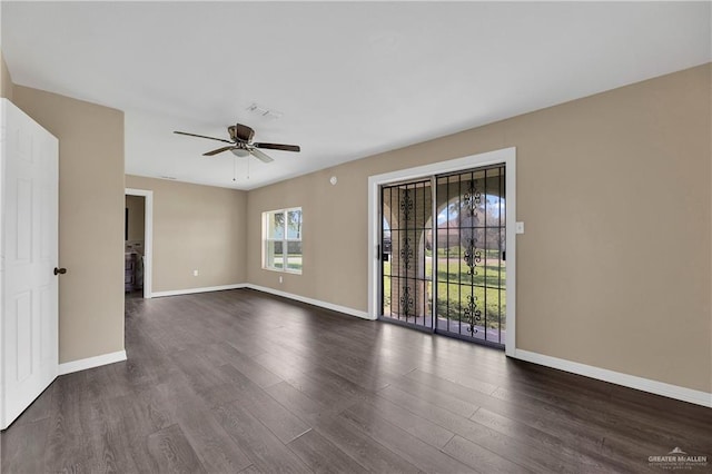 318 E 2nd Ave, Elsa, TX 78543 - unfurnished room with a ceiling fan, baseboards, and dark wood-style floors