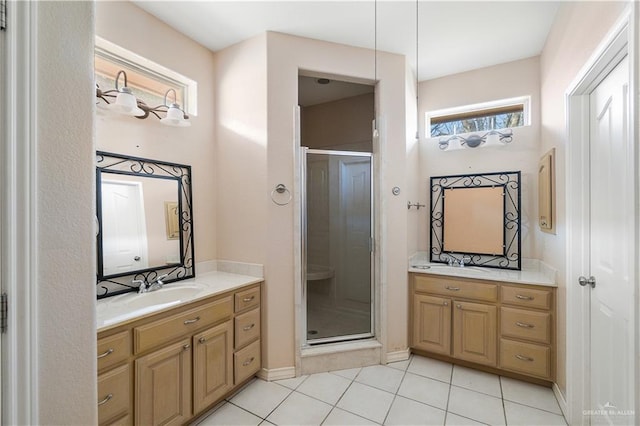 bathroom with vanity, an enclosed shower, and tile patterned floors