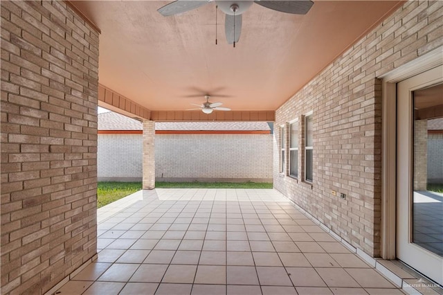 view of patio featuring ceiling fan