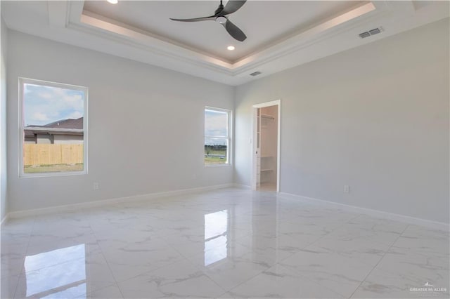 2605 Linva Ave, Edinburg, TX 78542 - spare room featuring a tray ceiling, light marble finish floors, a ceiling fan, recessed lighting, and crown molding