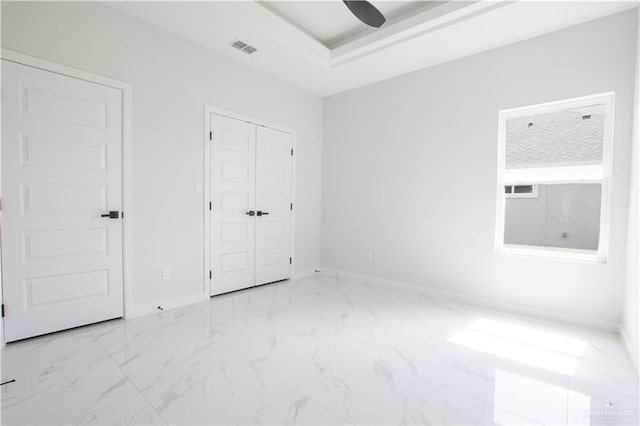 2605 Linva Ave, Edinburg, TX 78542 - unfurnished bedroom with marble finish flooring, a closet, and a ceiling fan