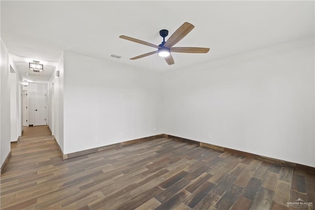 1815 W Adelita St, Weslaco, TX 78599 - unfurnished room featuring dark wood-type flooring and ceiling fan